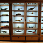 ** A well-lit display cabinet showcasing various model airplanes and cars. The focus is on the organized arrangement and the use of LED lighting to highlight the details of the models. Consider showing models from different eras (e.g., WWII planes, classic cars from the 60s). The environment should be clean and dust-free.

**
